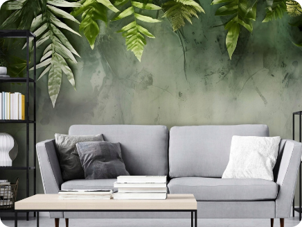 Dekoracja ścienna z motywem zielonych liści nad sofą – nowoczesna aranżacja salonu